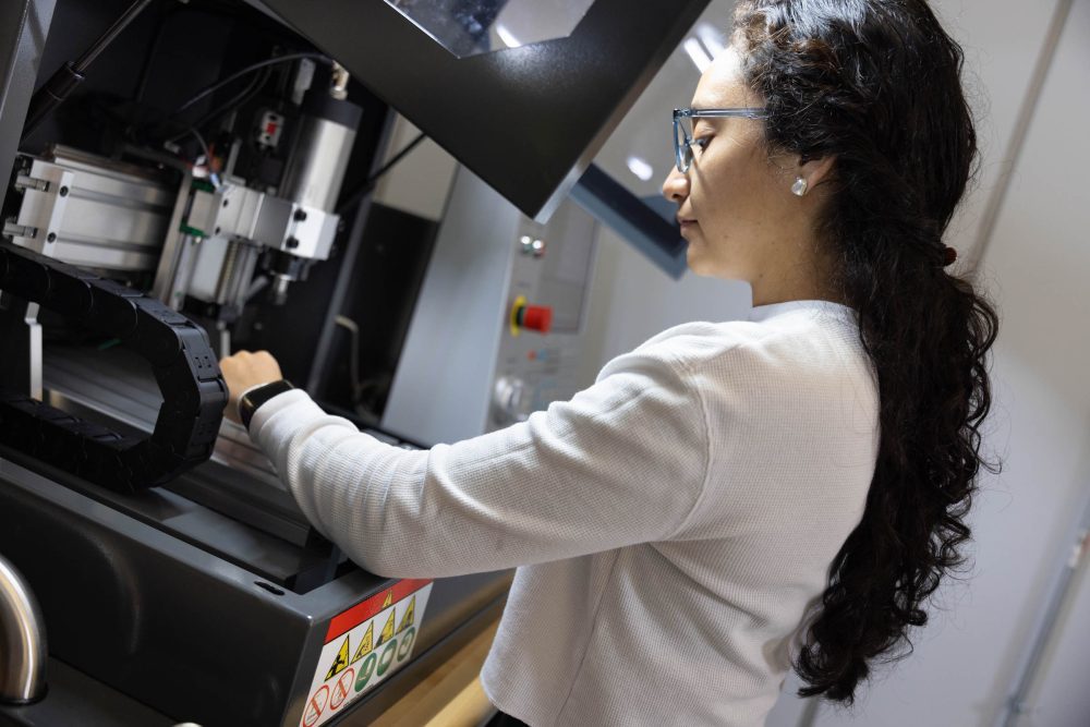 Student working at machine in Super Fab Lab