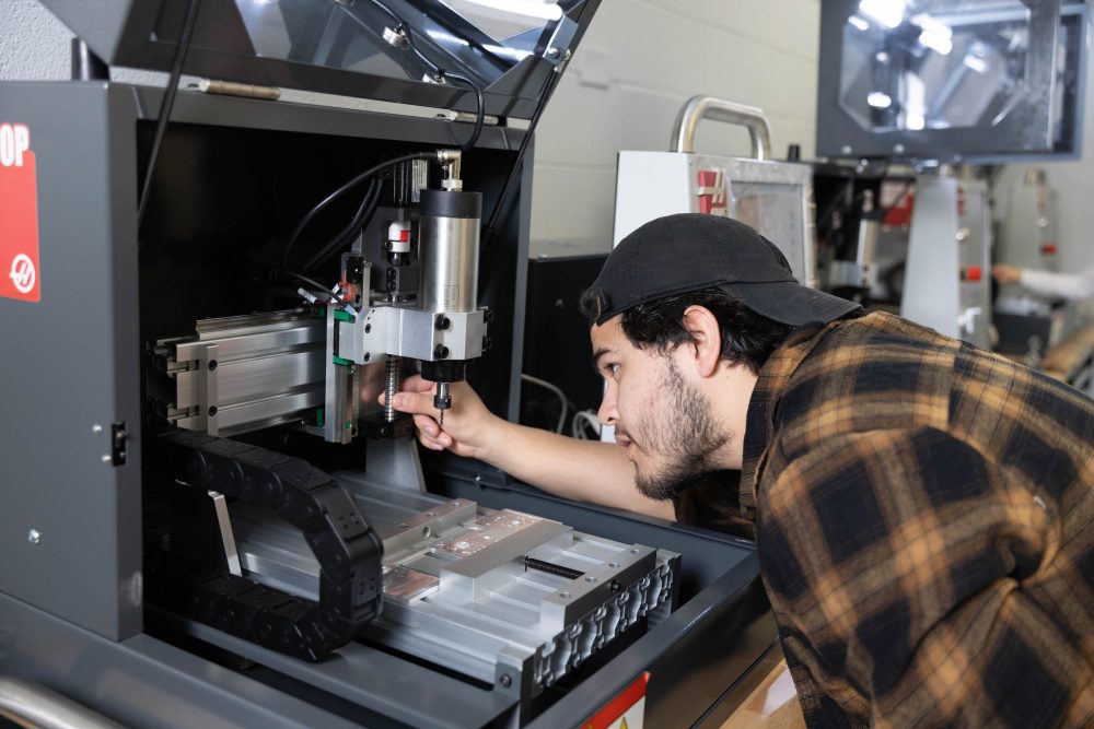 Student working at machine in Super Fab Lab